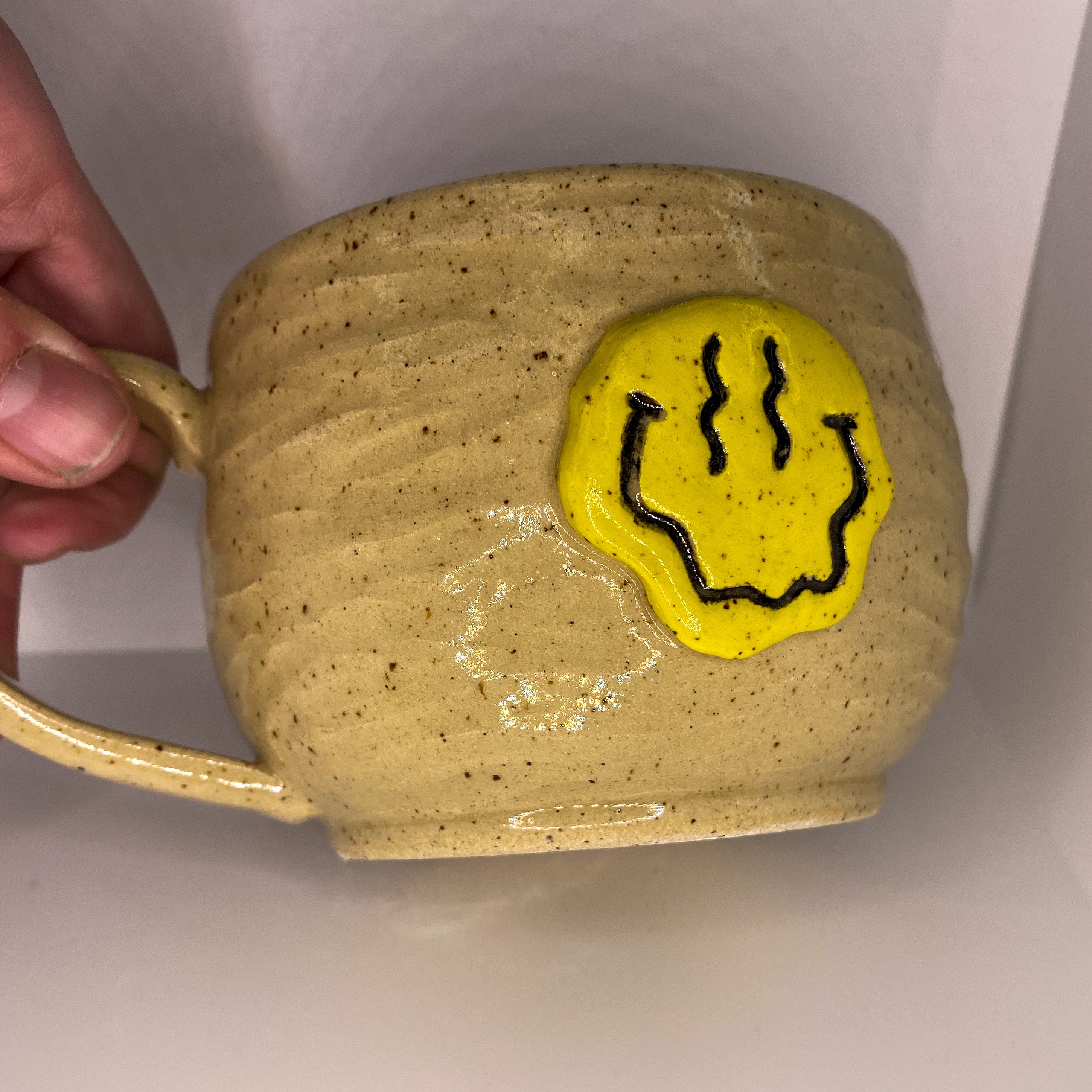 Melted Happy Face Speckled Mug